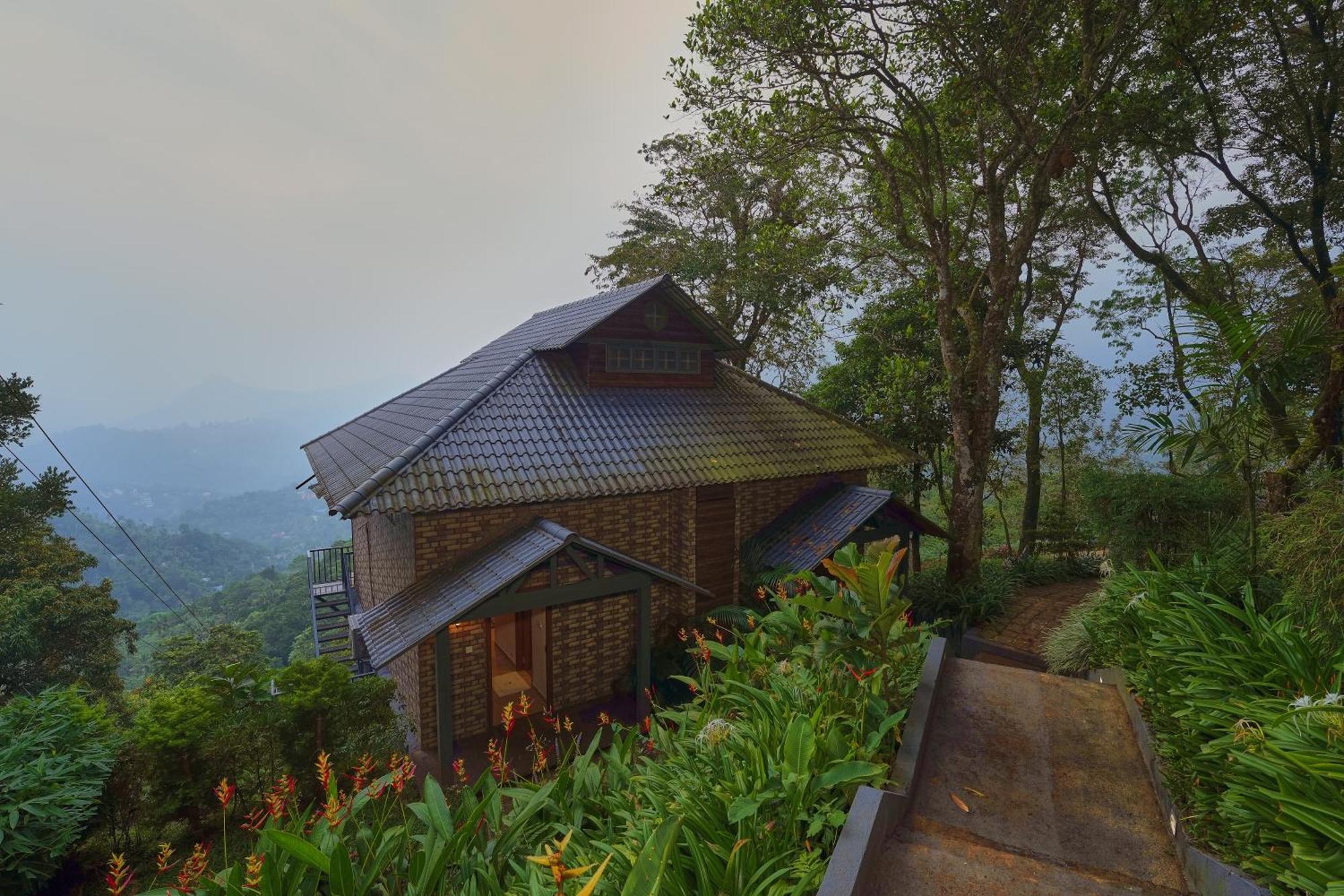 Elephant Passage Munnar Exterior photo A cottage at the resort